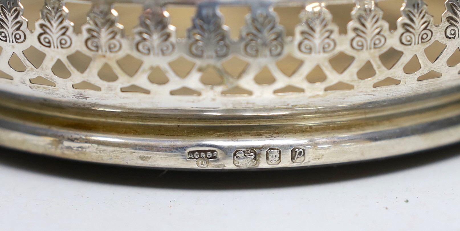 A modern pierced silver mounted wine coaster, A. Chick & Sons Ltd, London, 1970, diameter 13.3cm.